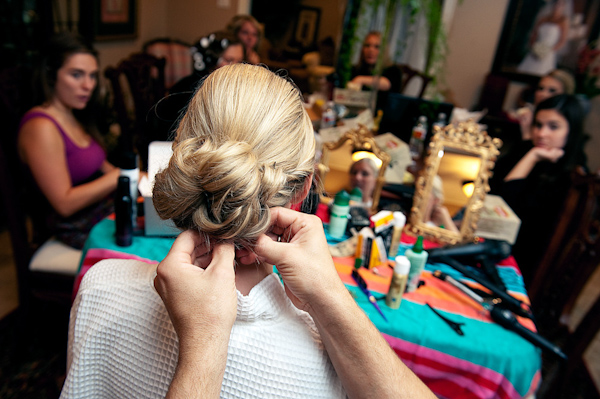 the bride getting ready with her bridesmaids - photo by Houston based wedding photographer Adam Nyholt